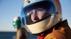 Person practicing motorcycle safety by wearing a helmet.